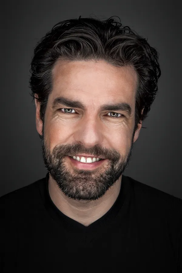 A man with a full head of thick, brown hair. Get Formula 82M for hair loss treatment from Carolyn Zaumeyer, MSN, APRN at LowTE Florida® in Greater Fort Lauderdale.