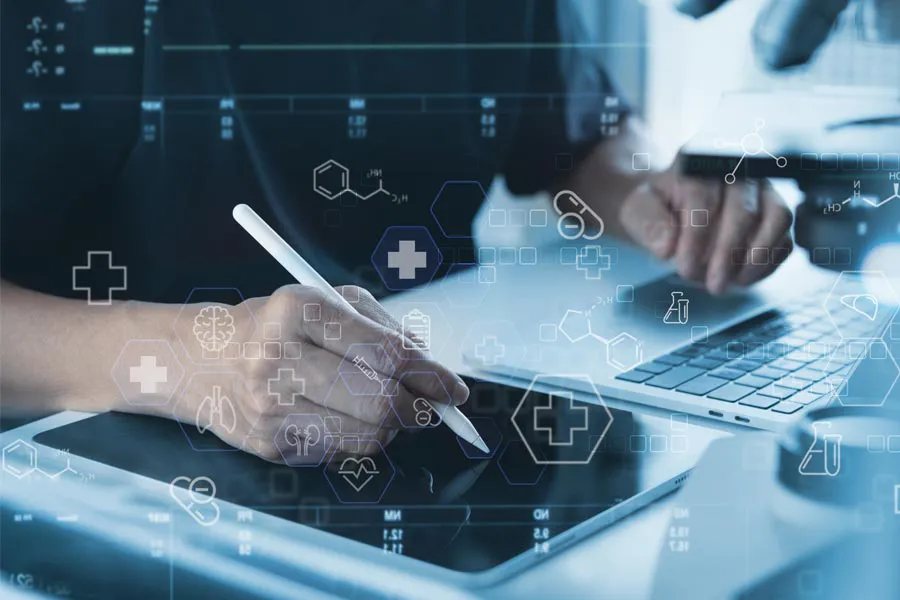 Close-up of a medical professional using a laptop and tablet, with illustrated medical symbols overlayed on the image, symbolizing health conditions treated by Carolyn Zaumeyer, MSN, APRN at LowTE Florida® in Greater Fort Lauderdale.